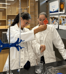 A photo of two students from Mount St Joseph (MSJ) Milperra experimenting in a science lab